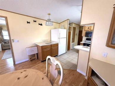 TWO BEDROOM, TWO BATHROOM MOBILE HOME IN ACTIVE 55+ COMMUNITY on River Run Golf Links in Florida - for sale on GolfHomes.com, golf home, golf lot