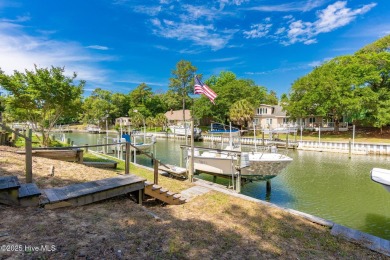 Welcome to this beautifully maintained 4-bedroom, 2-bath coastal on The Country Club of the Crystal Coast in North Carolina - for sale on GolfHomes.com, golf home, golf lot