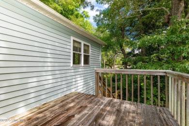 Welcome to this beautifully maintained 4-bedroom, 2-bath coastal on The Country Club of the Crystal Coast in North Carolina - for sale on GolfHomes.com, golf home, golf lot