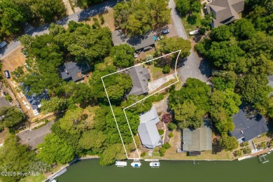 Welcome to this beautifully maintained 4-bedroom, 2-bath coastal on The Country Club of the Crystal Coast in North Carolina - for sale on GolfHomes.com, golf home, golf lot