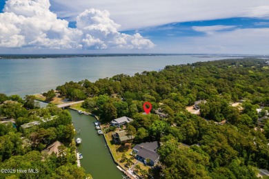 Welcome to this beautifully maintained 4-bedroom, 2-bath coastal on The Country Club of the Crystal Coast in North Carolina - for sale on GolfHomes.com, golf home, golf lot