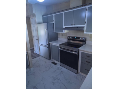 Welcome to this COMPLETELY UPDATED home in Orange Blossom, The on Stonecrest Golf and Club Club in Florida - for sale on GolfHomes.com, golf home, golf lot