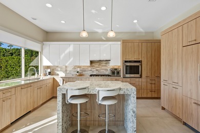 Experience modern luxury and sophisticated design in this fully on Rancho Mirage Country Club in California - for sale on GolfHomes.com, golf home, golf lot