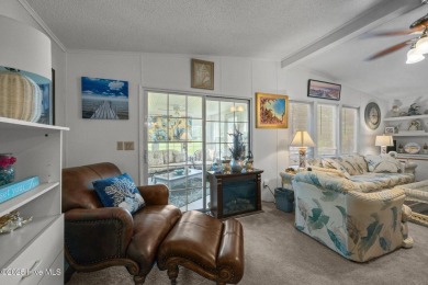 Welcome to your dream retreat in the serene community of Topsail on Topsail Green Golf Club in North Carolina - for sale on GolfHomes.com, golf home, golf lot