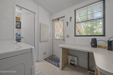 Welcome to your dream retreat in the serene community of Topsail on Topsail Green Golf Club in North Carolina - for sale on GolfHomes.com, golf home, golf lot