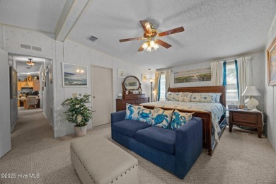 Welcome to your dream retreat in the serene community of Topsail on Topsail Green Golf Club in North Carolina - for sale on GolfHomes.com, golf home, golf lot