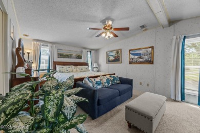 Welcome to your dream retreat in the serene community of Topsail on Topsail Green Golf Club in North Carolina - for sale on GolfHomes.com, golf home, golf lot