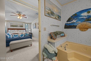 Welcome to your dream retreat in the serene community of Topsail on Topsail Green Golf Club in North Carolina - for sale on GolfHomes.com, golf home, golf lot
