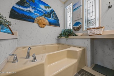 Welcome to your dream retreat in the serene community of Topsail on Topsail Green Golf Club in North Carolina - for sale on GolfHomes.com, golf home, golf lot