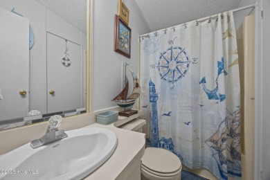 Welcome to your dream retreat in the serene community of Topsail on Topsail Green Golf Club in North Carolina - for sale on GolfHomes.com, golf home, golf lot