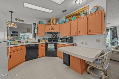Welcome to your dream retreat in the serene community of Topsail on Topsail Green Golf Club in North Carolina - for sale on GolfHomes.com, golf home, golf lot