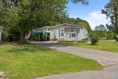 Welcome to your dream retreat in the serene community of Topsail on Topsail Green Golf Club in North Carolina - for sale on GolfHomes.com, golf home, golf lot