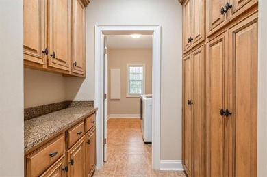 Meticulously maintained and truly move-in ready, this beautiful on Oak Grove Island Golf and Country Club in Georgia - for sale on GolfHomes.com, golf home, golf lot