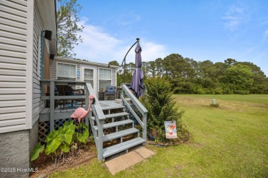 Welcome to your dream retreat in the serene community of Topsail on Topsail Green Golf Club in North Carolina - for sale on GolfHomes.com, golf home, golf lot