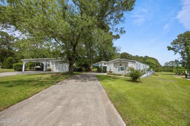 Welcome to your dream retreat in the serene community of Topsail on Topsail Green Golf Club in North Carolina - for sale on GolfHomes.com, golf home, golf lot