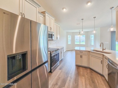 Recently purchased but never lived in! This beautiful 3-bedroom on The Grand Club - Pine Lakes Course in Florida - for sale on GolfHomes.com, golf home, golf lot