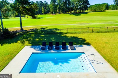 Overlooking the 17th green and inground pool, this gem is on Oak Mountain Championship Golf Club in Georgia - for sale on GolfHomes.com, golf home, golf lot