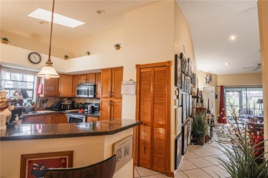 This charming two-bedroom, two-bathroom townhouse offers a on Woodmont Country Club in Florida - for sale on GolfHomes.com, golf home, golf lot