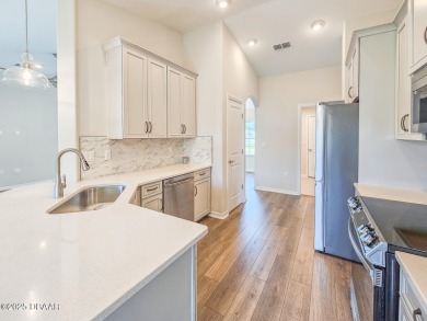 Recently purchased but never lived in! This beautiful 3-bedroom on The Grand Club - Pine Lakes Course in Florida - for sale on GolfHomes.com, golf home, golf lot