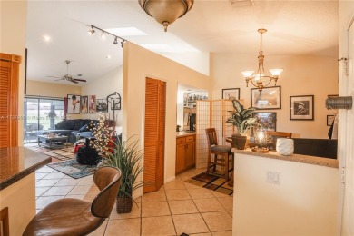 This charming two-bedroom, two-bathroom townhouse offers a on Woodmont Country Club in Florida - for sale on GolfHomes.com, golf home, golf lot