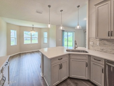 Recently purchased but never lived in! This beautiful 3-bedroom on The Grand Club - Pine Lakes Course in Florida - for sale on GolfHomes.com, golf home, golf lot