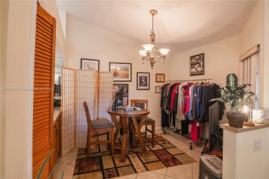 This charming two-bedroom, two-bathroom townhouse offers a on Woodmont Country Club in Florida - for sale on GolfHomes.com, golf home, golf lot