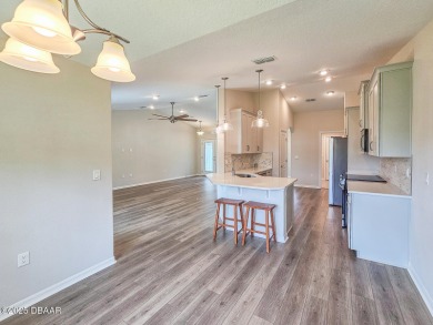 Recently purchased but never lived in! This beautiful 3-bedroom on The Grand Club - Pine Lakes Course in Florida - for sale on GolfHomes.com, golf home, golf lot