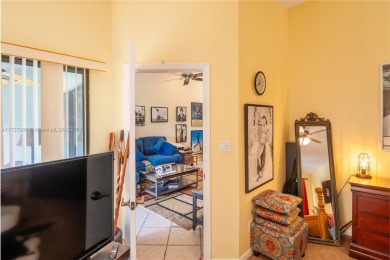 This charming two-bedroom, two-bathroom townhouse offers a on Woodmont Country Club in Florida - for sale on GolfHomes.com, golf home, golf lot