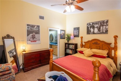 This charming two-bedroom, two-bathroom townhouse offers a on Woodmont Country Club in Florida - for sale on GolfHomes.com, golf home, golf lot