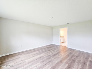 Recently purchased but never lived in! This beautiful 3-bedroom on The Grand Club - Pine Lakes Course in Florida - for sale on GolfHomes.com, golf home, golf lot