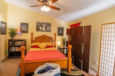 This charming two-bedroom, two-bathroom townhouse offers a on Woodmont Country Club in Florida - for sale on GolfHomes.com, golf home, golf lot