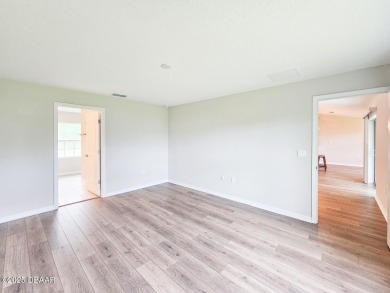 Recently purchased but never lived in! This beautiful 3-bedroom on The Grand Club - Pine Lakes Course in Florida - for sale on GolfHomes.com, golf home, golf lot