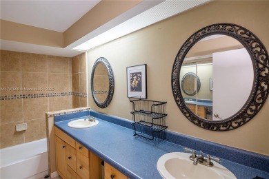 This charming two-bedroom, two-bathroom townhouse offers a on Woodmont Country Club in Florida - for sale on GolfHomes.com, golf home, golf lot