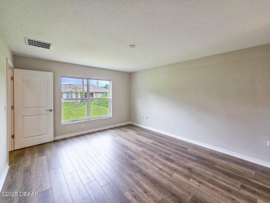 Recently purchased but never lived in! This beautiful 3-bedroom on The Grand Club - Pine Lakes Course in Florida - for sale on GolfHomes.com, golf home, golf lot