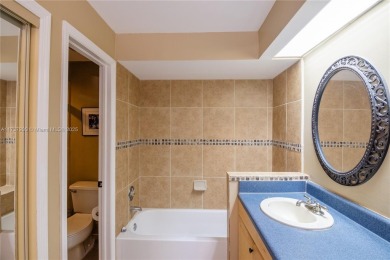 This charming two-bedroom, two-bathroom townhouse offers a on Woodmont Country Club in Florida - for sale on GolfHomes.com, golf home, golf lot