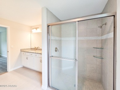 Recently purchased but never lived in! This beautiful 3-bedroom on The Grand Club - Pine Lakes Course in Florida - for sale on GolfHomes.com, golf home, golf lot