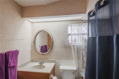 This charming two-bedroom, two-bathroom townhouse offers a on Woodmont Country Club in Florida - for sale on GolfHomes.com, golf home, golf lot