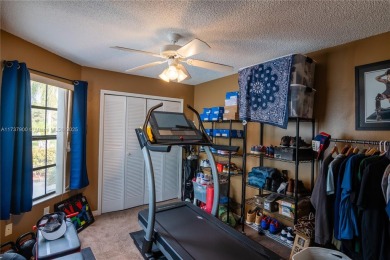 This charming two-bedroom, two-bathroom townhouse offers a on Woodmont Country Club in Florida - for sale on GolfHomes.com, golf home, golf lot