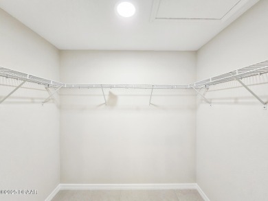 Recently purchased but never lived in! This beautiful 3-bedroom on The Grand Club - Pine Lakes Course in Florida - for sale on GolfHomes.com, golf home, golf lot