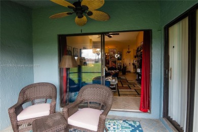 This charming two-bedroom, two-bathroom townhouse offers a on Woodmont Country Club in Florida - for sale on GolfHomes.com, golf home, golf lot