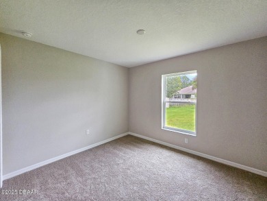 Recently purchased but never lived in! This beautiful 3-bedroom on The Grand Club - Pine Lakes Course in Florida - for sale on GolfHomes.com, golf home, golf lot