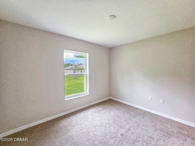 Recently purchased but never lived in! This beautiful 3-bedroom on The Grand Club - Pine Lakes Course in Florida - for sale on GolfHomes.com, golf home, golf lot