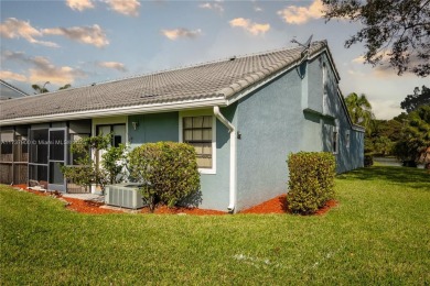 This charming two-bedroom, two-bathroom townhouse offers a on Woodmont Country Club in Florida - for sale on GolfHomes.com, golf home, golf lot