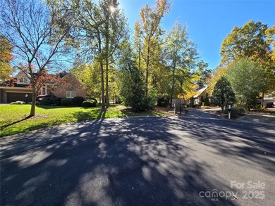 This golf course lot is located on the 10th fairway of the Old on Old North State Club at Uwharrie Point Golf community in North Carolina - for sale on GolfHomes.com, golf home, golf lot