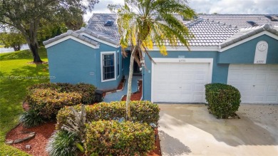 This charming two-bedroom, two-bathroom townhouse offers a on Woodmont Country Club in Florida - for sale on GolfHomes.com, golf home, golf lot