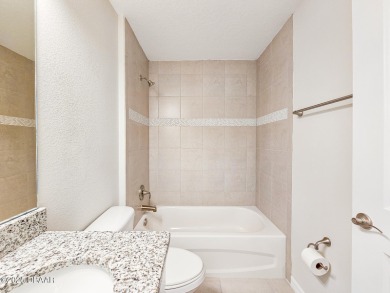 Recently purchased but never lived in! This beautiful 3-bedroom on The Grand Club - Pine Lakes Course in Florida - for sale on GolfHomes.com, golf home, golf lot