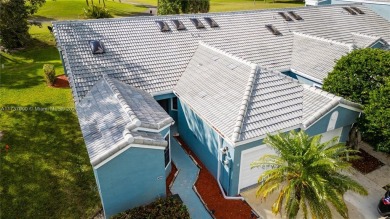 This charming two-bedroom, two-bathroom townhouse offers a on Woodmont Country Club in Florida - for sale on GolfHomes.com, golf home, golf lot