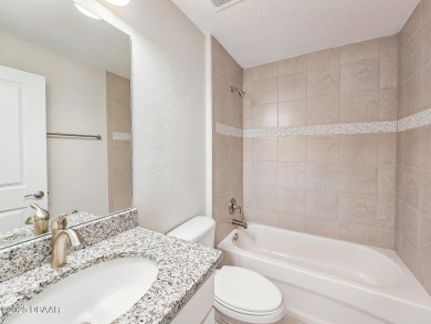 Recently purchased but never lived in! This beautiful 3-bedroom on The Grand Club - Pine Lakes Course in Florida - for sale on GolfHomes.com, golf home, golf lot