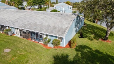 This charming two-bedroom, two-bathroom townhouse offers a on Woodmont Country Club in Florida - for sale on GolfHomes.com, golf home, golf lot