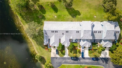 This charming two-bedroom, two-bathroom townhouse offers a on Woodmont Country Club in Florida - for sale on GolfHomes.com, golf home, golf lot